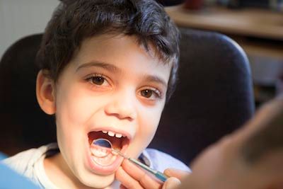 young patient getting a dental checkup at Passes Dental Care