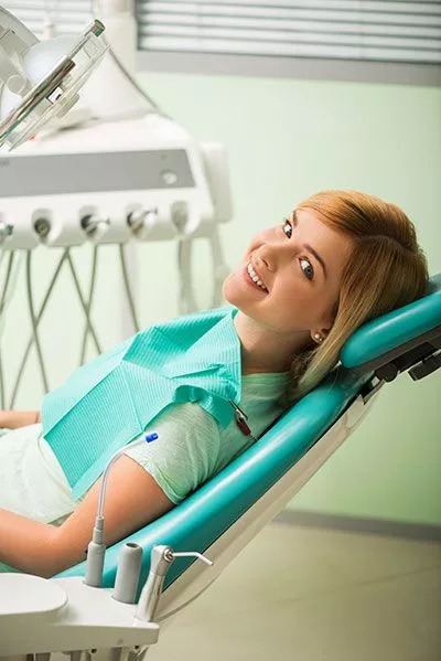 patient smiling in the dental chair at Passes Dental Care