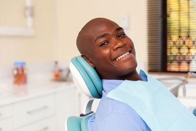 patient smiling after getting his teeth cleaned at Passes Dental Care